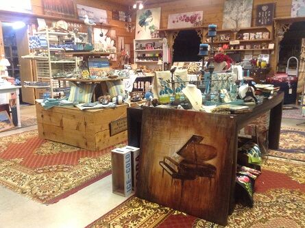 View of a very cozy, warm wooden shop interior with gifts and trinkets everywhere