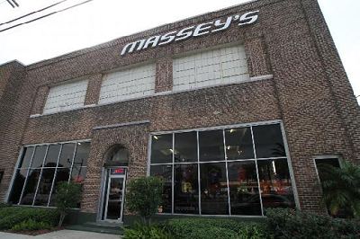 Exterior view of a large People Play's store with logo hanging from the cieling